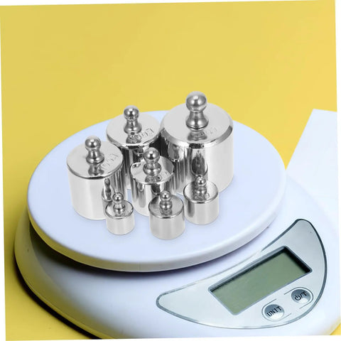 High Precision Calibration Weights For Digital Scales And Lab Use displayed on electronic scale