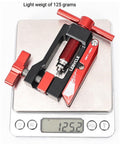Hydraulic Disc Brake Hose Cutter And Needle Barb Driver Tool For Bikes on scale showing 125 grams, black and red aluminum