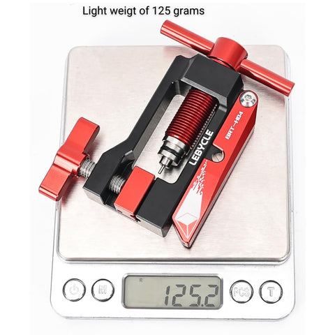 Hydraulic Disc Brake Hose Cutter And Needle Barb Driver Tool For Bikes on scale showing 125 grams, black and red aluminum