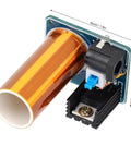 Close-up of Mini Coil Kit Coil Module Wireless Power Transmitter for DIY electronics with copper coil and input jack.