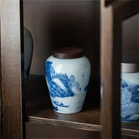 Ceramic Airtight Tea Canister With Heavy Duty Wooden Lid For Loose Leaf Stashing And Coffee Bean Storage Artisan Handpainted Kitchen Jar on a shelf.