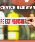Inside Fire Extinguisher Sign Stickers 10 Pack Reflective Vinyl Decals UV Resistant Waterproof being applied on glass.