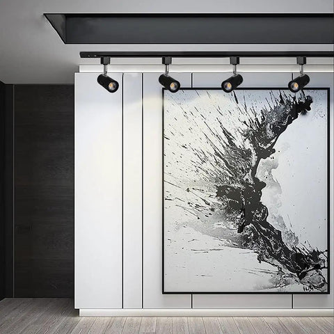 Dimmable LED Track Lighting Heads For H Type Systems spotlight illuminating artwork in a modern room, black finish
