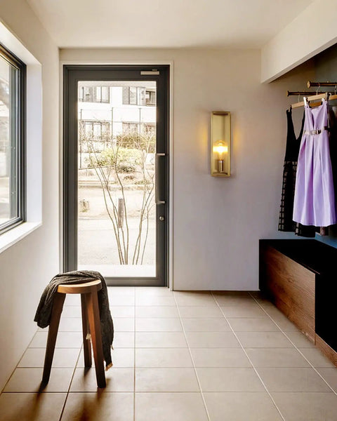 Indoor view with Outdoor Wall Light Waterproof Exterior Sconce, brushed brass frame, placed near front door, clear glass shade visible