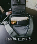 Open clamshell of Prvke Zip 21L V4 Photography Bundle Weatherproof Travel Camera Backpack with gear inside on a table