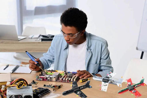 Student using Dope Soldering Practice Kit For Beginners Build Two Mini Display Aircraft With 3 Color LEDs A Hands On STEM Project