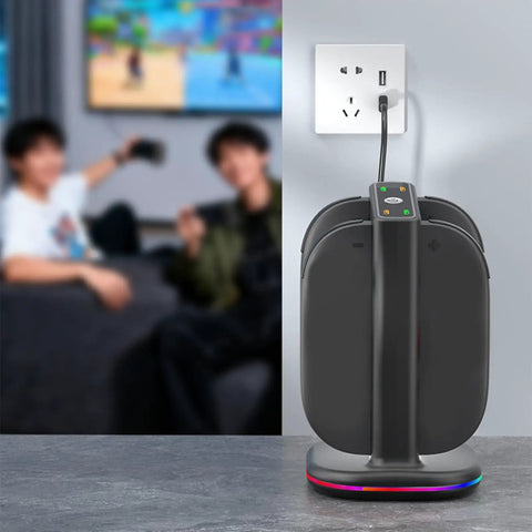 Controller Fast Charging Station With Touch Glow Lights For Nintendo Switch 2 Featuring 9 Color Breathing Modes Instant Status Tracking Quick Plug Play Gaming Rgb Vibe Dock positioned on a table near a wall outlet.
