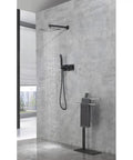 Shower System, 10-Inch Rainfall Head with Handheld Sprayer, Valve Included mounted on gray wall with flowing water.