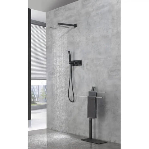 Shower System, 10-Inch Rainfall Head with Handheld Sprayer, Valve Included mounted on gray wall with flowing water.