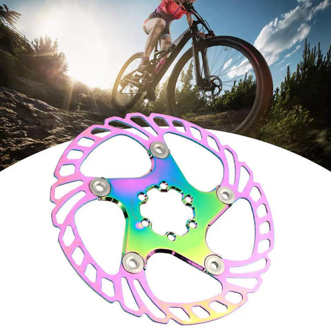 Premium Mountain Bike Disc Brake Pads 180mm with stainless steel and aluminum backing, showcased against a rider on a dirt trail.