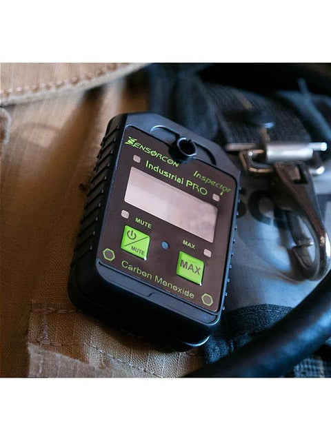 Sensorcon Industrial Pro CO monitor, black device with green MUTE/MAX buttons mounted on a vest.
