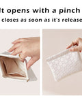 Leather Cosmetic Pouch For Purse With Secure Snap Closure And Slim Profile in white being opened and closed.