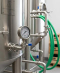 2.5 Inch Glycerin Filled Pressure Gauge 0 To 300 PSI 20 Bar With One Quarter Inch NPT Lower Mount on industrial equipment