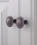 Oil Rubbed Bronze Round Cabinet Knobs 1.4 Inch Set Of 10 Rustic Floral Zinc Alloy Handles installed on cabinet doors