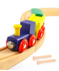 Miniature Wooden Nails Set For Dope Crafting And Woodworking With Solid Wood Rods next to a wooden toy train on a track
