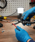 Hands using 9 In 1 Electrician Pliers Set With Sturdy Carbon Steel For Wire Stripping Cutting Crimping And More on red wire