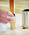 Applying stain on table leg with Eliminator Butyl Drop Cloth 4 Ft By 15 Ft Heavy Duty Leak Proof Slip Resistant Reusable Paint Stain Drop Cloth.