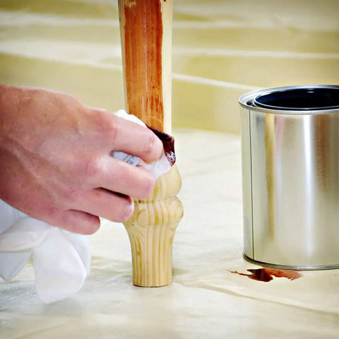 Applying stain on table leg with Eliminator Butyl Drop Cloth 4 Ft By 15 Ft Heavy Duty Leak Proof Slip Resistant Reusable Paint Stain Drop Cloth.