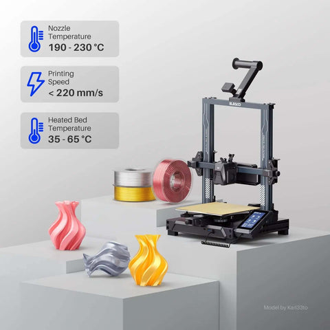 3D printer setup with Silk Copper PLA Filament 1.75mm, 1kg Spool showing vibrant prints