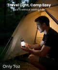 Person holding Ultra Bright Camping Lantern With 1000LM LED Floodlight And 5000mAh Battery inside a tent at night
