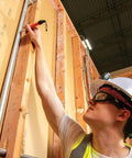 Construction worker using Retractable Marker Holder With Four Foot Cord For Skribes Paint Markers Fits Ultra Fine Fine And Chisel Tip Permanent Markers Keeps Pencils And Markers Handy On The Job on wood frames.