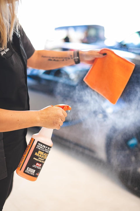 Person spraying Bead Maker Paint Sealant For No Fuss Spray And Wipe Protection On Cars, Boats, And RVs With Hydrophobic Gloss