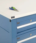 Built Tough Heavy Duty Production Workbench For Real Shop Jobs, ESD Laminated Top With Deep Storage Drawers And Lower Shelf, Height Adjustable Steel Frame, Rock Solid 5000 Lb Load Capacity, Blue top with pliers.