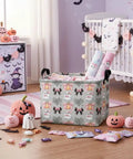 Dope Boo Halloween Basket For Kids With Pink Bow Glowing Ghost Canvas Trick Or Treat Tote Sweet Candy Storage Bin in a decorated room.