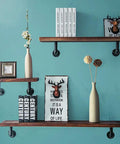 Beefy Iron Pipe Shelf Brackets For 7 To 14 Inch Boards, supporting floating shelves in industrial style, 6 pack in black.