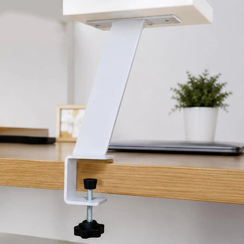 Adjustable Iron Table Leg For Desk Height Increase And Ergonomic Setup attached to wooden surface with angled support