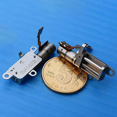 Mini 5mm Stroke Linear Actuator 2 Phase 4 Wire Stepper Motor With Precision Metal Gearbox beside a coin for size reference.