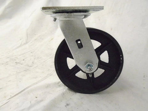 Front view: 6x2 in swivel caster with iron/steel wheel on metal mounting plate; black spoked wheel.