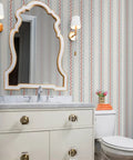 Top Shelf Vinyl Wallpaper Featuring Subtle Leather Grain And Eclectic Funky Patterns in a bathroom setting with a mirror and sink.