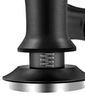 Close up of black seven piece espresso tamper kit designed for 51mm filter cups with measurement scale for precise brewing.