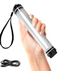 Hand holding Waterproof Rechargeable LED Flashlight And Power Bank For Camping And Outdoor Adventures Rugged IP68 Submersible Light