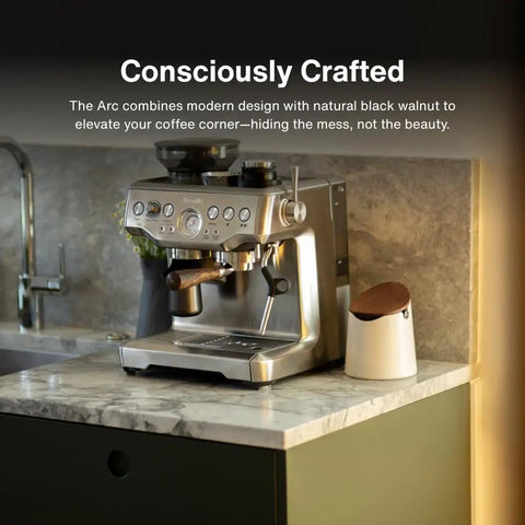 Arc Knock Box For Espresso Pucks Holds 12 To 16 Pucks A Durable ABS Construction With A Non Slip Base White Base With Walnut Lid next to espresso machine