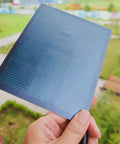Hand holding Ultra Thin Flexible CIGS Solar Panel Charger For Portable Power On The Go, 6.69x5.51 Inches size