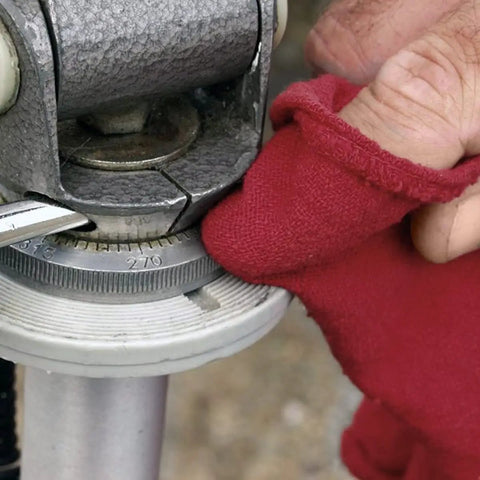 Red gloved hand using 150 Pack Cotton Shop Towels Rags 14x12 Inches Absorbent, Reusable Cleaning Rags For Auto Shops on machinery.