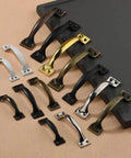 Assorted door pulls on display, featuring Vintage Five Inch Door Pulls 2 Pack Bow Shaped Gate Handles In Red Bronze Finish
