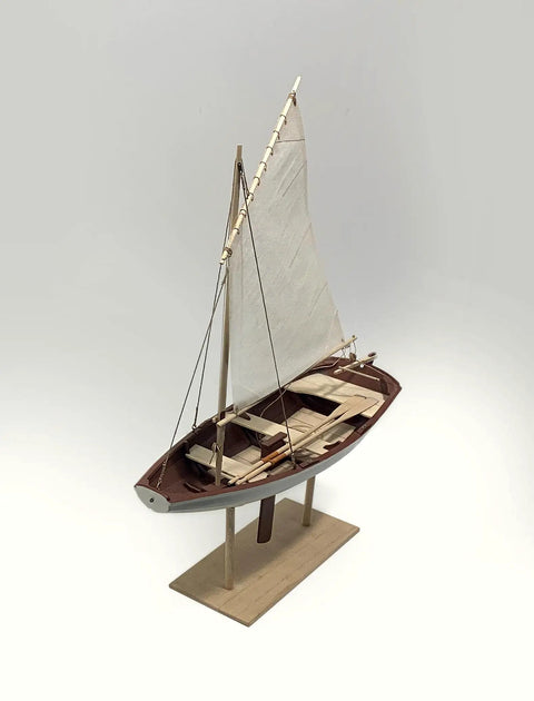 Norwegian Sailing Pram Model Kit 1:12 Scale For Adults, DIY Woodcraft Project displayed on a wooden stand
