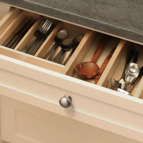 Antique Silver Round Cabinet Knobs Six Pack on kitchen drawer with utensils