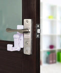 White childproof door handle lock for cabinets and doors installed on a brown door, easy no drill install to keep kids safe at home