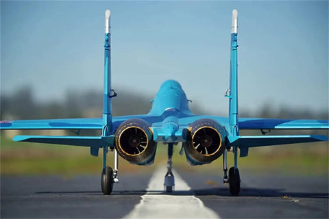 Rear view of 6 Channel RC Plane SU 27 70mm Ducted Fan EDF With 12 Blade Inrunner Motors on runway, aerodynamics in focus