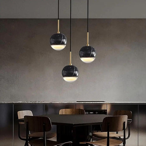 LTNANJE Modern LED Small Natural Stone Pendant Light Fixture with black marble design in dining room setting.