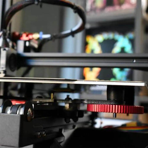 3D printer with 12Pcs Silicone Bed Spacers And Mounts For 3D Printers Easy Bed Leveling Kit installed, showing red spacer.