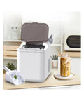Fast Countertop Ice Maker Portable With Self Cleaning Setup Produces Crisp Cubes In Minutes, showing ice cubes and drink setup.