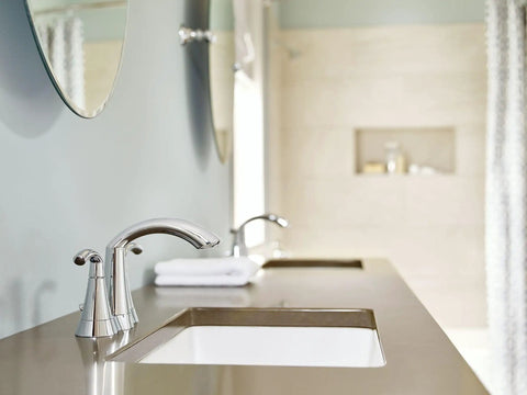 Glyde Chrome Two Handle High Arc Centerset Bathroom Faucet With Sleek Finish in a modern bathroom setting