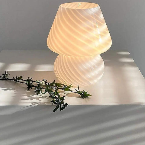 Mushroom Glass Desk Lamp With White Stripes, Vintage Murano Hand-Blown Style, glowing on table with decorative foliage
