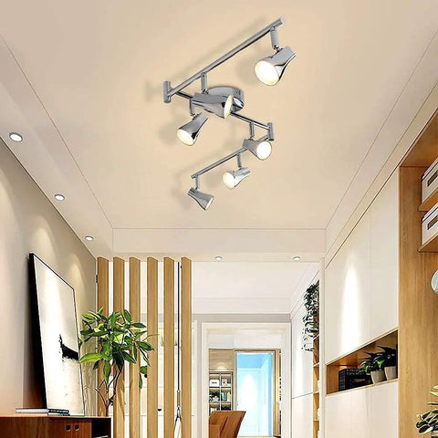Ceiling view of Dope Four Light Track Lighting Kit With Flexible Rotatable Heads And Alabaster Glass Shades in modern room