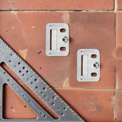 Heavy Duty Stainless Steel Wall Panel Clamps 100 Piece Set Quick Grip Snap In Hardware on a work surface with a square.
